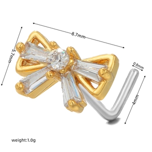 Detail showing 8.7mm golden bow nose stud with dimensions and macro crystal texture