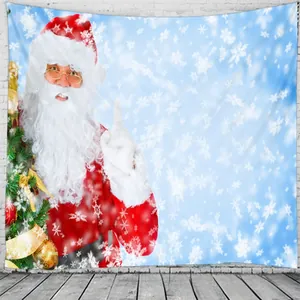 Detail of Christmas tapestry featuring Santa Claus and tree on a white brick wall