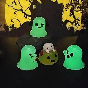 Luminous Halloween owl and ghost miniature figurines glowing in the dark scenery