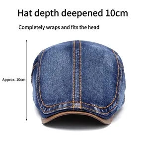 Deep blue washed denim flat cap with orange stitching and brown leather trim edge