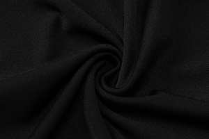 Detailed macro shot of premium black textile fabric texture for elegant evening dress