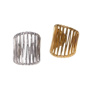 Minimalist 18k gold and silver hollow woven stainless steel rings on white background
