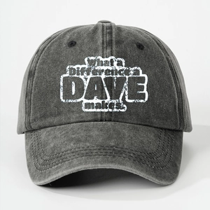 Detail of washed grey baseball cap featuring vintage printed text and cotton texture