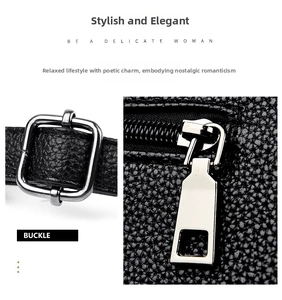 Close-up of silver metal buckle and polished zipper on black lychee pattern leather tote bag