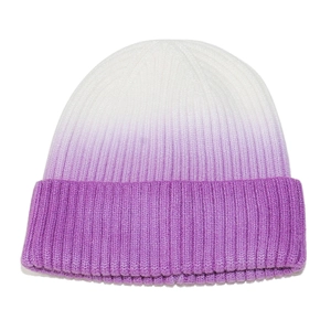 Detail of a winter knit beanie featuring a white to purple gradient tie-dye ribbed texture