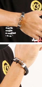 Detail of woven leather bracelet with stainless steel interlocking buckle for men