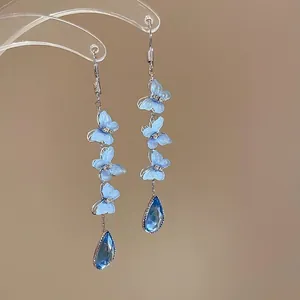 Blue butterfly tassel earrings with teardrop crystal pendants for summer vacation style