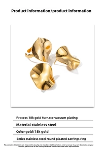 Detail of gold 18K plated stainless steel earrings and ring set with ripple texture