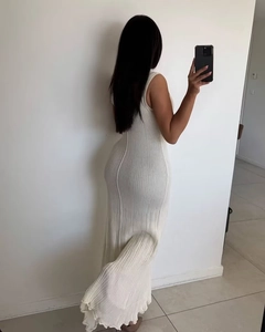 Rear view of a slim-fit knit sleeveless maxi dress in cream white with ribbing texture