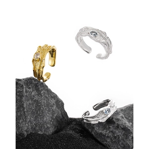 Irregular textured S925 sterling silver ring with crystals on a black volcanic stone