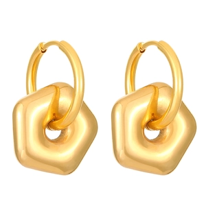 Detail of golden geometric hexagonal drop earrings with high-gloss metallic finish