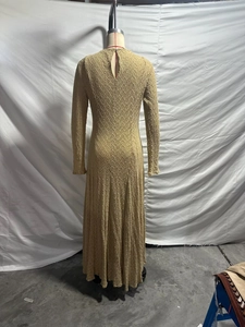Close-up of the back teardrop cutout and crochet texture on a khaki long-sleeve knit dress