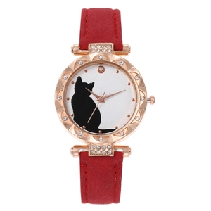 Detail of rose gold case with rhinestone bezel and cat silhouette dial on red strap