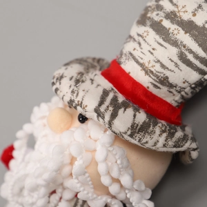 Christmas Santa plush gift bag with red velvet details and snowball beard pattern