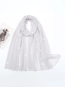 Detailed view of light gray chiffon scarf with elegant rhinestones and soft texture