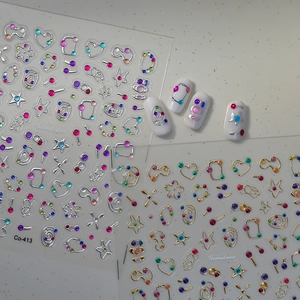 3D Gemstone nail art stickers with gold and silver outlines for DIY manicures