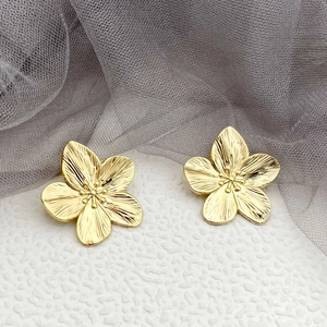 Gold-plated stainless steel flower stud earrings with a detailed radial brushed texture