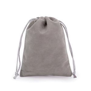 Detailed view of the soft grey velvet texture on a drawstring jewelry storage pouch