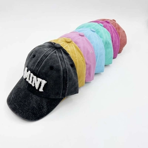 Detailed row of vintage washed cotton baseball caps with MINI embroidery in multiple colors