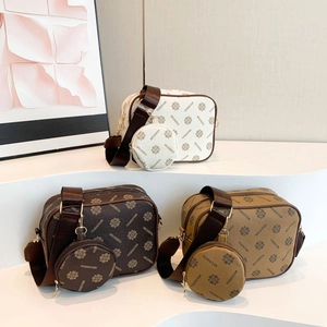 Minimalist crossbody camera bag set in multiple colors with stylish monogram pattern