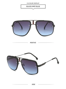Detail of black aviator sunglasses with double bridge and red temple stripe accents