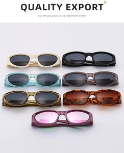 Collection of seven colorful vintage cat-eye sunglasses with oval frames on white background