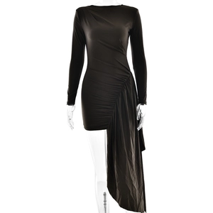 Detail of black long-sleeved dress featuring side ruching and elegant long draped panel
