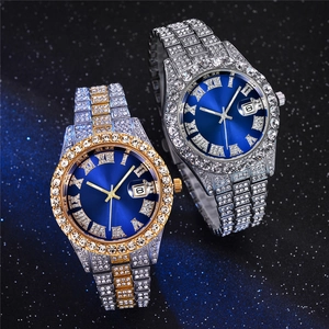 Detail of luxury iced-out steel watches with blue Roman dials and date window display