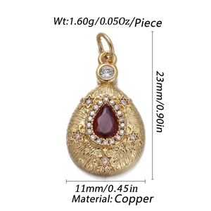 Macro view of teardrop pendant with red zircon and white stones in 23mm size