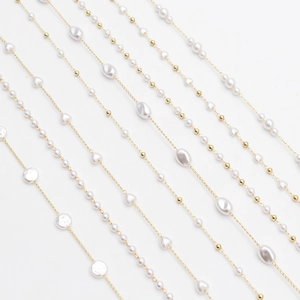 Elegant beaded pearl eyewear chain with gold accents and baroque heart-shaped charms