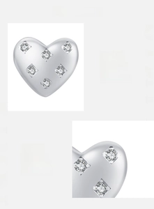 Detailed close-up of S925 sterling silver heart studs with hand-set 5A cubic zirconia