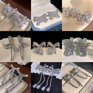 Sparkling silver bow knot earrings with zircons in various elegant Korean style designs