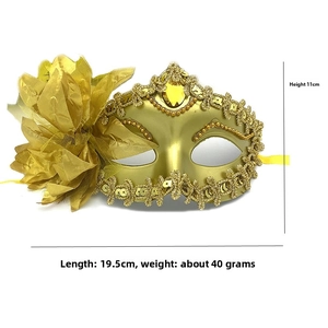 Detail of gold masquerade mask with fabric flower and sequins measuring 19.5cm by 11cm