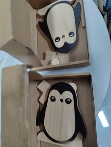 Handcrafted penguin shaped wooden glasses holder set in a minimalist gift box