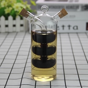 Dual-spout glass oil and vinegar dispenser with cork stoppers and inner bulb design