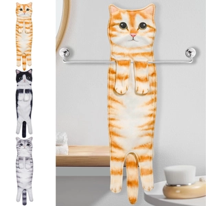 Detail view of cat-shaped hanging hand towels in orange, black-white and grey stripes