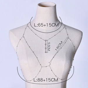 Detail view of a multi-layer sparkling body chain with size dimensions on a mannequin