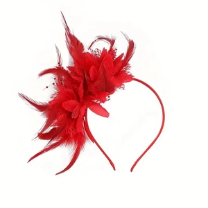 Detailed view of a red feather and flower fascinator headband for bridal tea parties