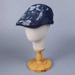 Retro distressed denim flat cap with ripped details and adjustable side buckle for men