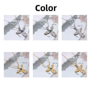 Detailed grid of phoenix wing pendant necklaces with teardrop gems and snake chains