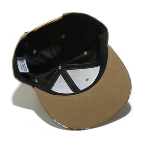 Detail view of cotton snapback hat interior with stitching and 100% cotton care label
