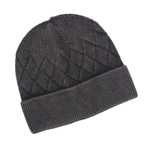 Detail of dark grey knit beanie showing thick diamond pattern and ribbed cuff texture
