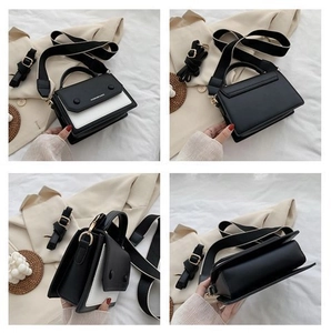 Detail view of contrast black and white shoulder bag with two detachable straps