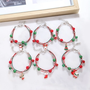 Set of six colorful Christmas charm bracelets with reindeer and snowman on braided ropes