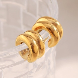Detailed view of gold plated stainless steel double layer ear cuffs with smooth finish