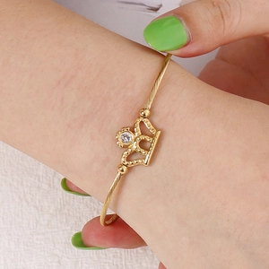 Elegant gold crown bangle with twisted rope design and white zircon for women