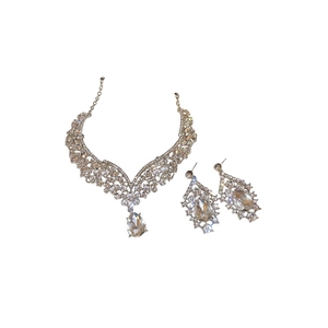 Elegant silver teardrop jewelry set with necklace and earrings on white background