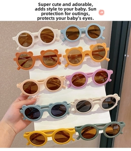 Detailed view of various colorful round toddler sunglasses with cute bear ear designs