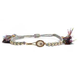 Detail of adjustable woven bracelet with tennis racket charm and colorful zircon accents