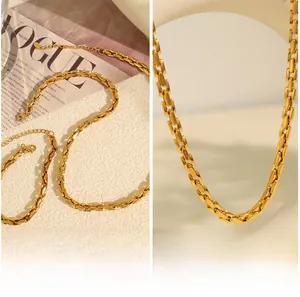 Close-up of golden stainless steel curb chain set with modern rectangular link design